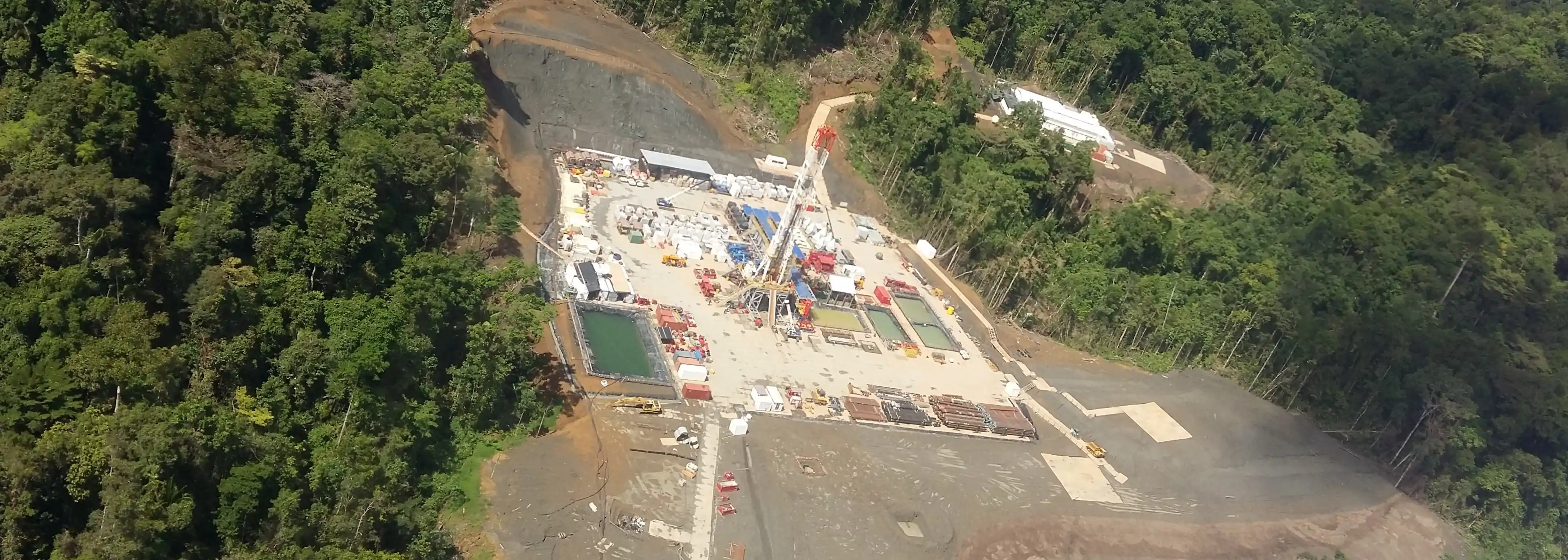 Earthworks for drilling rig pad construction